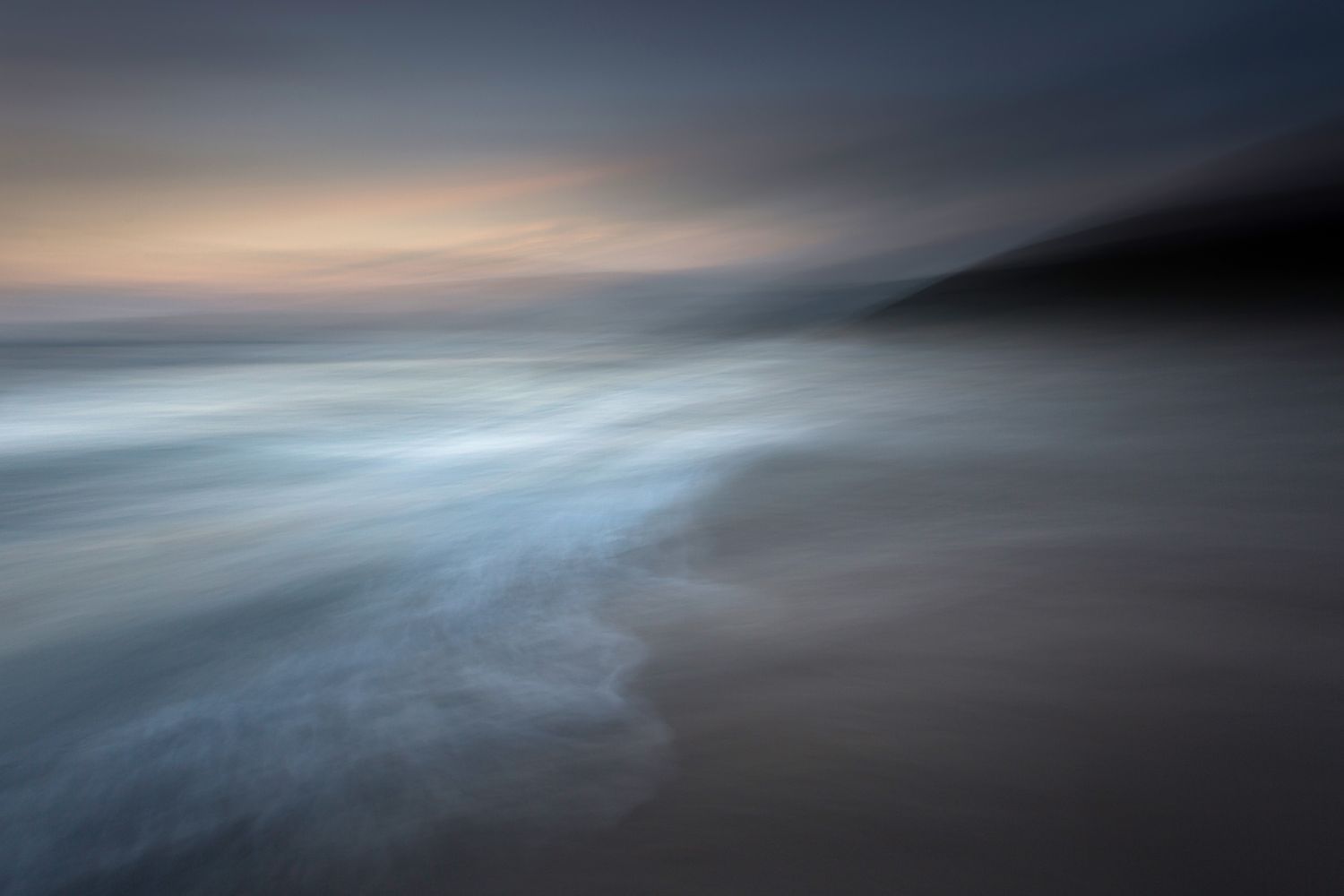 An abstract image of waves at a coast