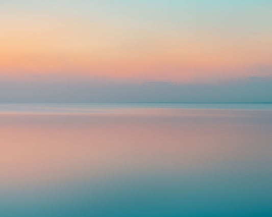 an abstract photography of a seascape during a sunrise or sunset.