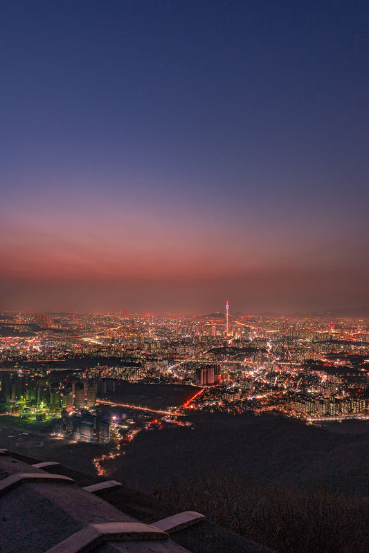 A photograph of a city skyline taken from an elevated view point 
